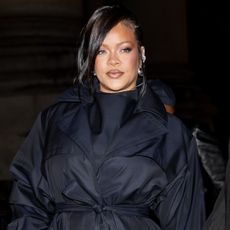 Rihanna was spotted in baggy jeans, statement sneakers, and a shawl, creating her latest high-low look