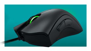 The Razer DeathAdder Essential gaming mouse on a teal deals background