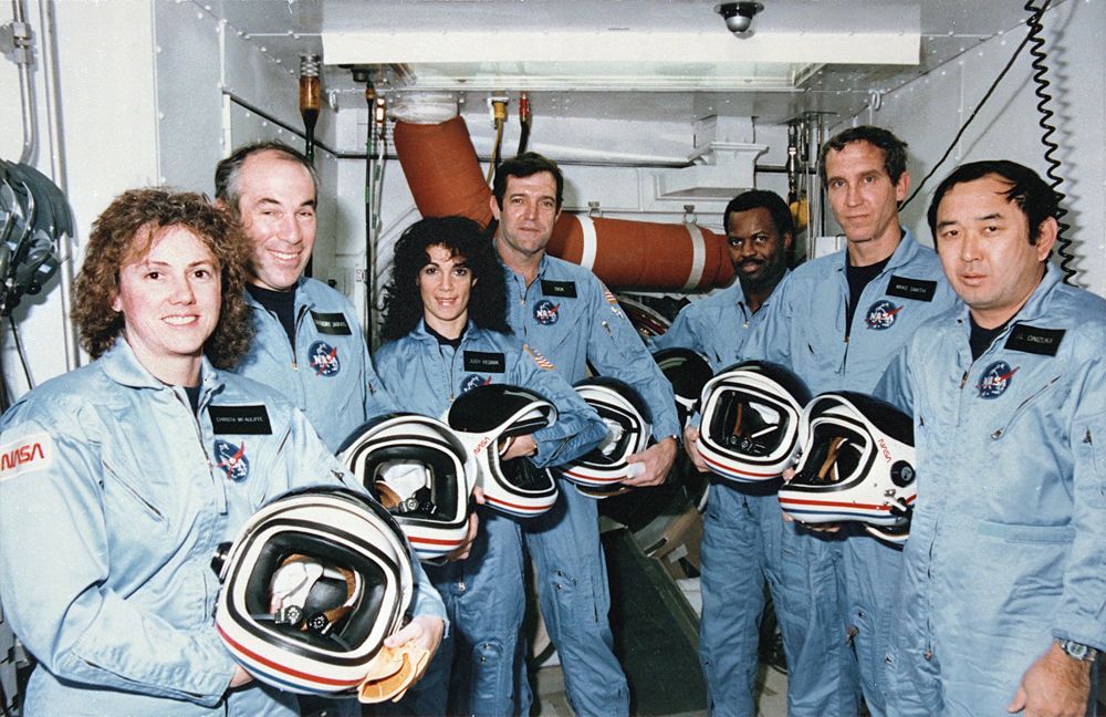 On Jan. 28, 1986, NASA faced its first shuttle disaster, the loss of the Challenger orbiter and its seven-astronaut crew. Here, Challenger's last crew &ndash; members of the STS-51L mission &ndash; stand in the White Room at Pad 39B following the end of a launch dress rehearsal. They are (L to R) Teacher in Space Participant, Sharon Christa McAuliffe, Payload Specialist, Gregory Jarvis, Mission Specialist, Judy Resnik, Commander Dick Scobee. Mission Specialist, Ronald McNair, Pilot, Michael Smith and Mission Specialist, Ellison Onizuka.