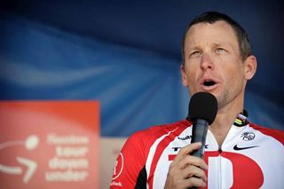 Shades of Paris 2005. Lance Armstrong (RadioShack) addresses the crowd.