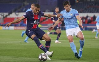 Kylian Mbappe of Paris Saint-Germain is challenged by Manchester City's Ruben Dias on April 28 in their Champions League semifinal first-leg match.