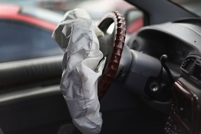 A deployed airbag in a Chrysler