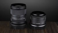 The Sigma 18-50mm f/2.8 DC DN | C Canon RF lens on a wooden surface against a dark background with moody lighting