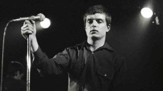 Joy DIvision performing onstage in 1980
