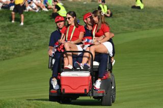Scottie Scheffler, Sam Burns, and their wives at the 2023 Ryder Cup