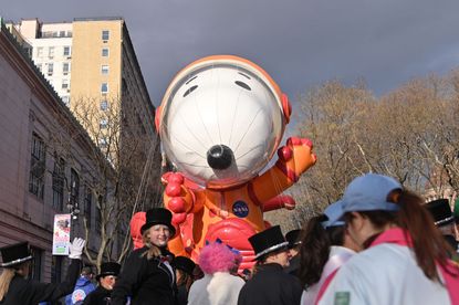 The Astronaut Snoopy balloon is prepared to float down the parade route during the 93rd Annual Macy's Thanksgiving Day Paade on November 28, 2019 in New York City.