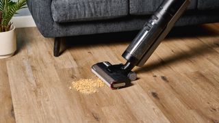 the dreame h12 pro wet and dry vacuum cleaner cleaning cheerios from a hard wood floor