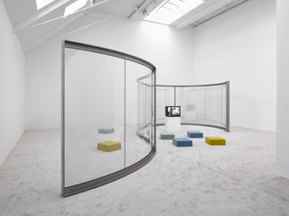 Dan Graham Stage Set for Music no 2 for Glenn, 2018 Stainless steel and two-way mirror. © Dan Graham, Courtesy Lisson Gallery