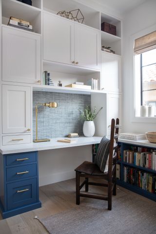 A home office with storage up to the ceiling