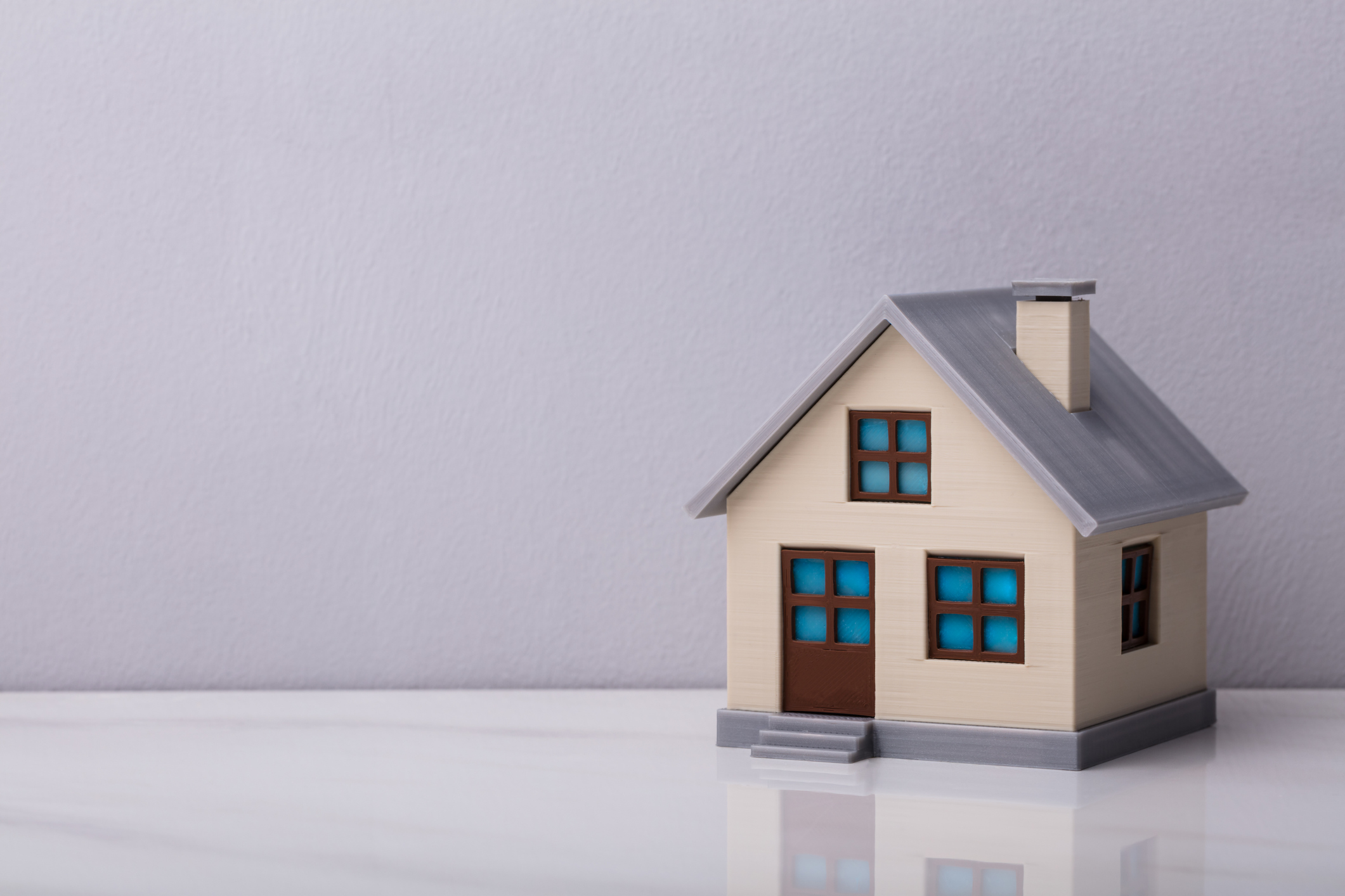 model house against a grey background