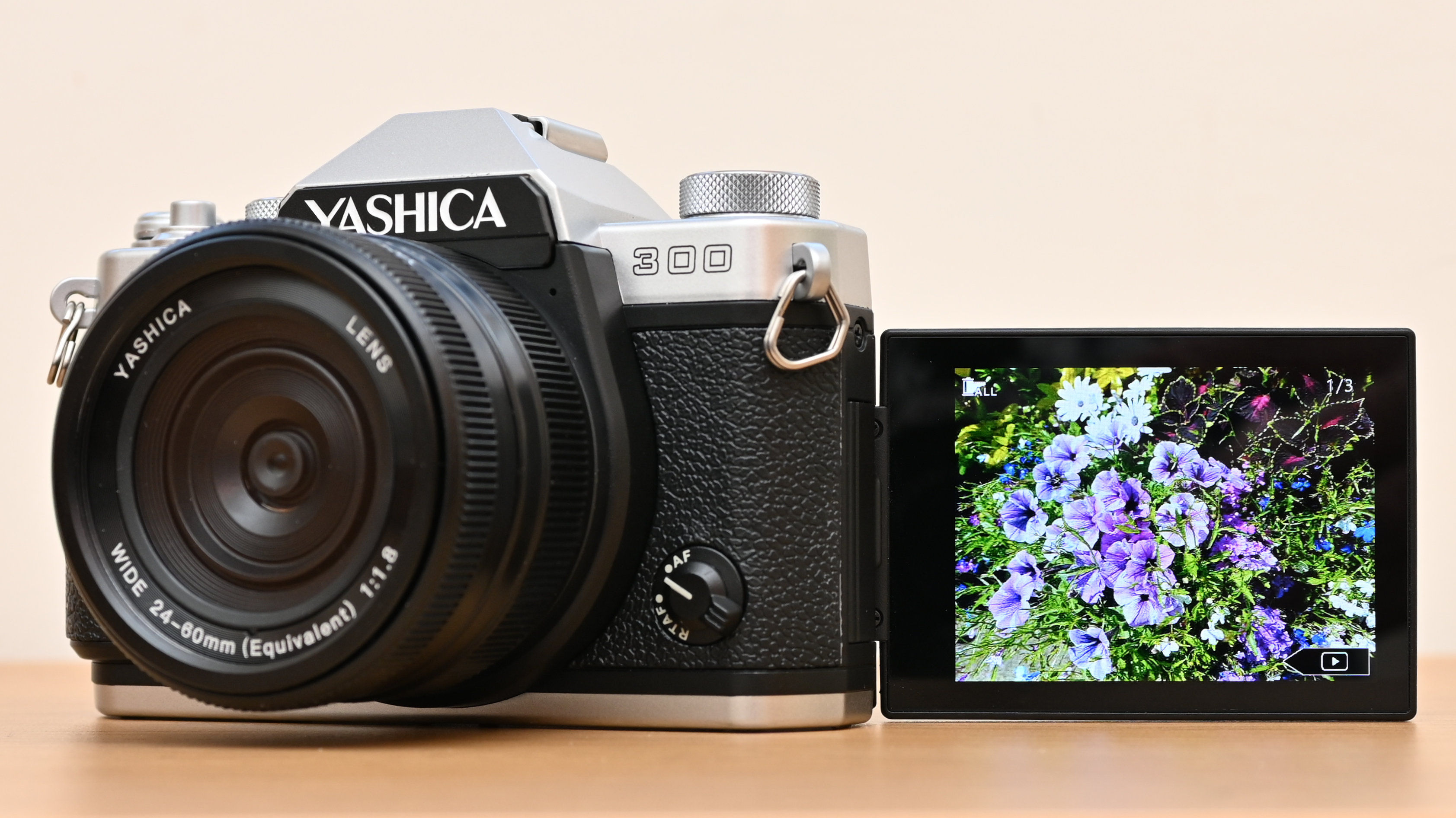 Yashica FX-D 300 product shot, camera held in hand