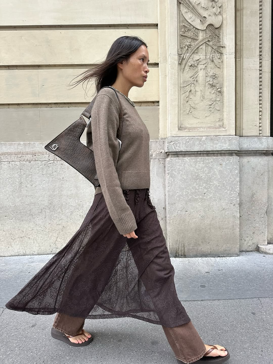 woman wearing dress over pants fall outfit 2025