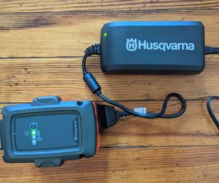 battery and charger for a cordless hedge trimmer