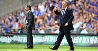 Sir Alex Ferguson manager of Manchester United gestures as Jose Mourinho manager of Chelsea looks on during the FA Cup Final match sponsored by E.ON between Manchester United and Chelsea at Wembley Stadium on May 19, 2007 in London, England.