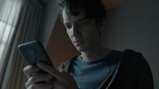 Nicolas looks at his phone in Apple TV Plus psychological thriller series Disclaimer