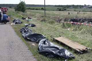 Body bags at the side of a road at the crash site of Malaysia Airlines flight MH17 - vital evidence could be lost if things not documented properly.