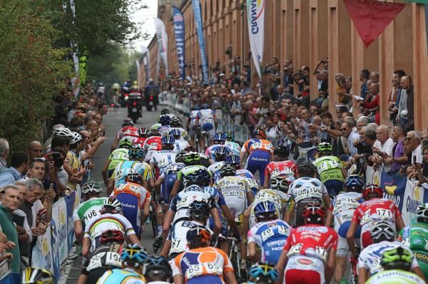 Riders climb the San Luca