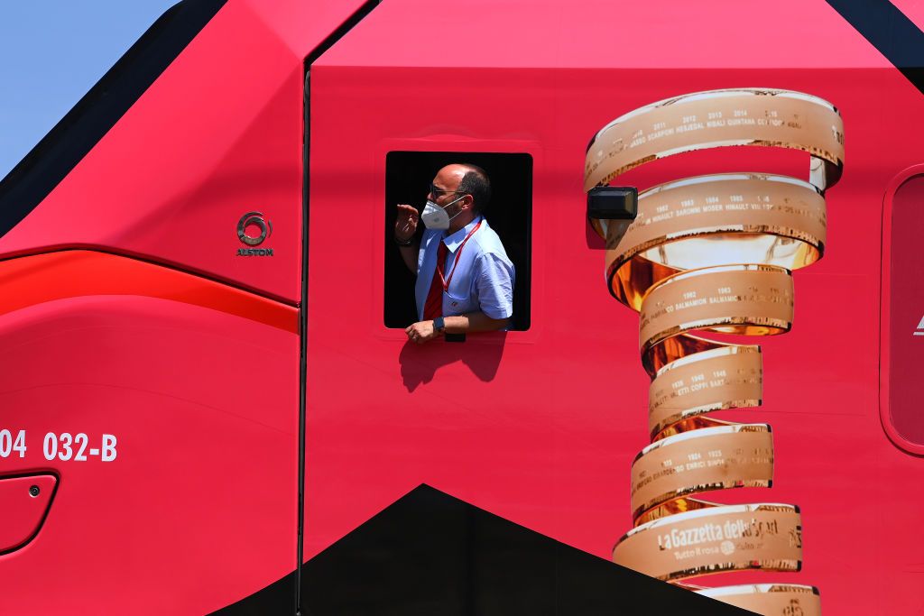 A train decorated in pink and with the Giro d&#039;Italia Senza Fine Trophy 