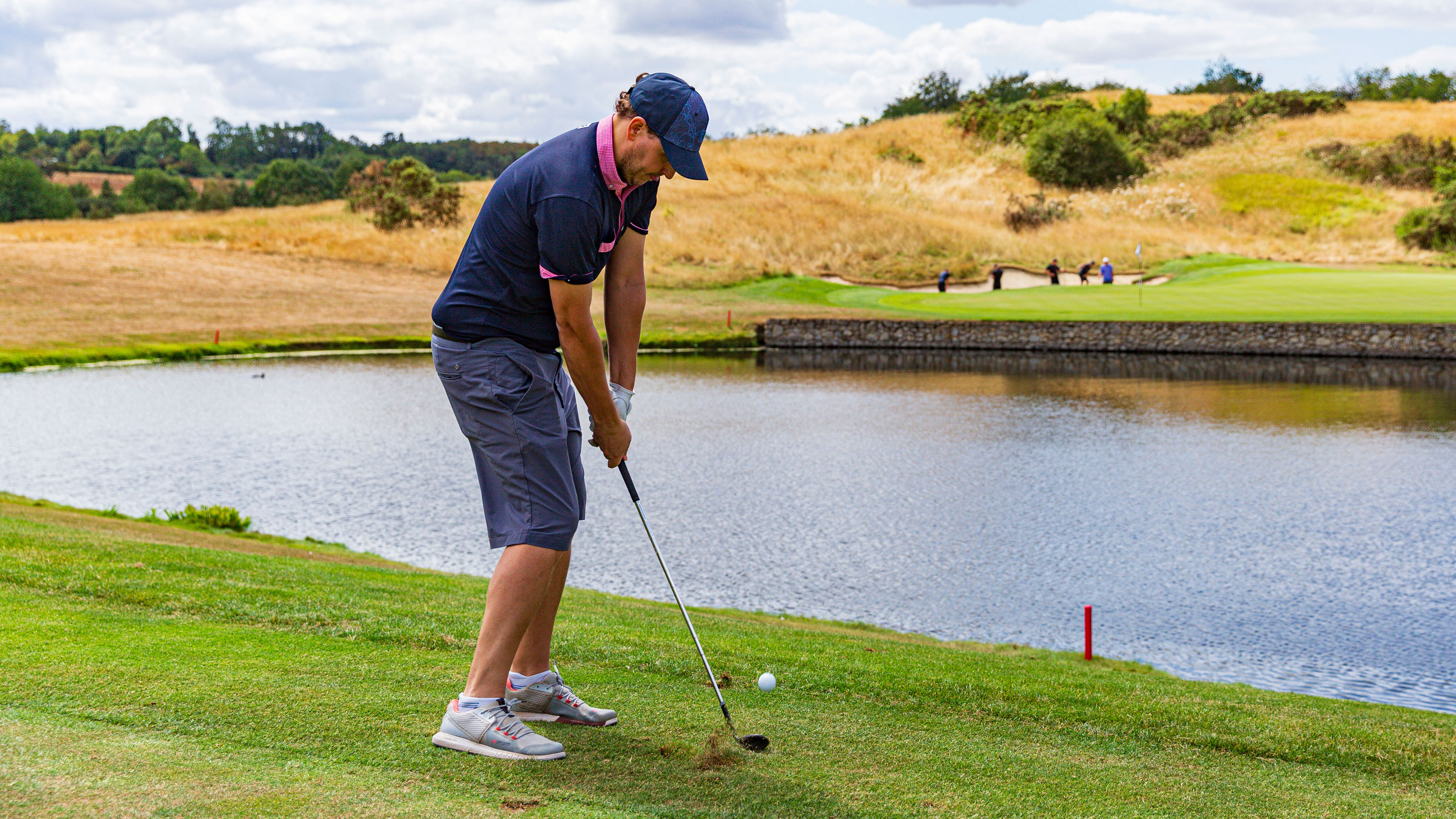 Nick Bonfield hitting a golf ball at Centurion Club