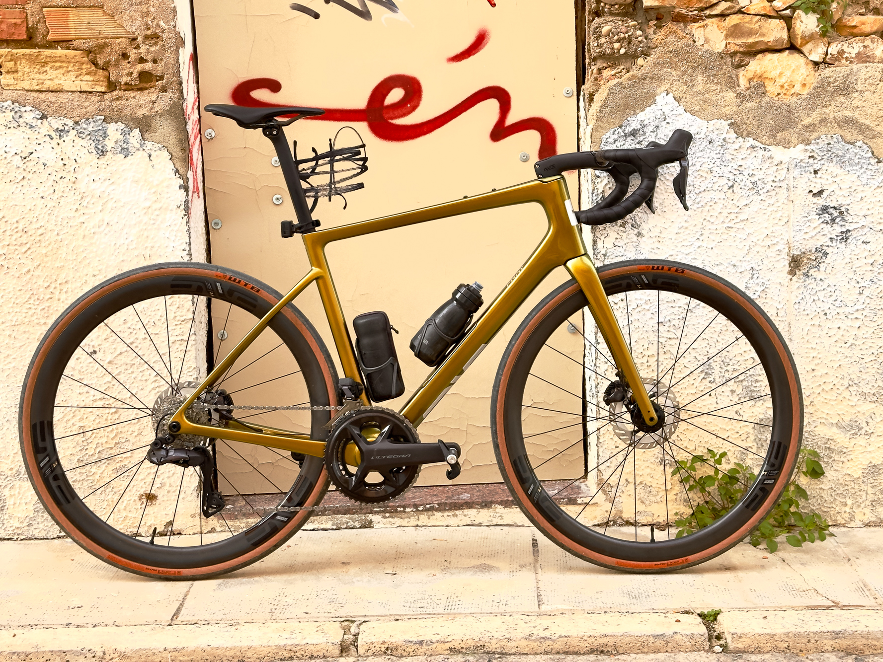 ENVE Fray bike leaning against a graffiti covered door