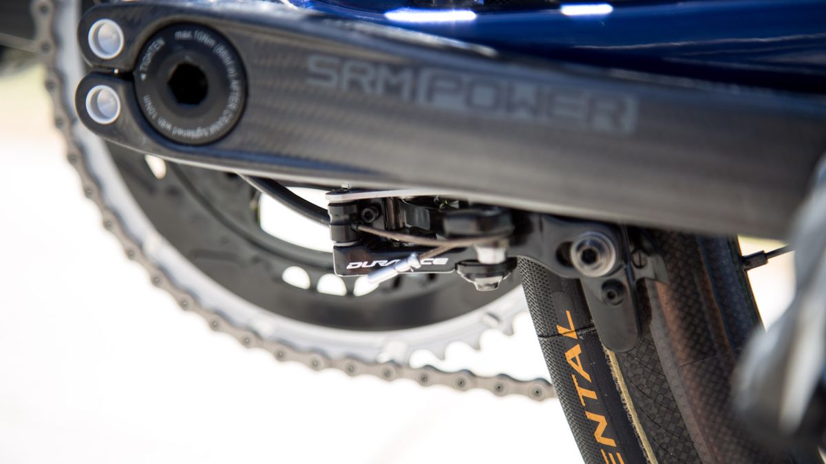 The rear brake is positioned under the bottom bracket