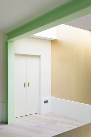 white pocket door in a minimalist hallway