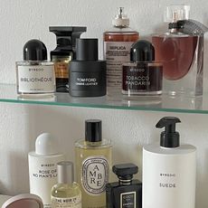 Photo of fragrance collection on a bathroom shelf