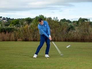 Golf Monthly Top 50 Coach Dan Grieve demonstrating a drill to prevent swaying in the golf swing