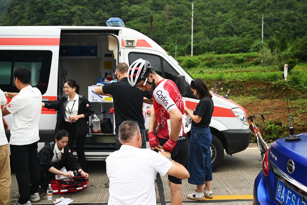 BAMA CHINA OCTOBER 17 Piet Allegaert of Belgium and Team Cofidis is treated by medical services during the 5th GreeTour Of Guangxi 2024 Stage 3 a 214km stage from Jingxi to Bama UCIWT on October 17 2024 in Bama China Photo by Dario BelingheriGetty Images