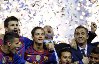 Pep Guardiola celebrates with his Barcelona players after his last match in charge, a 3-0 win over Athletic Club in the Copa del Rey final in May 2012.