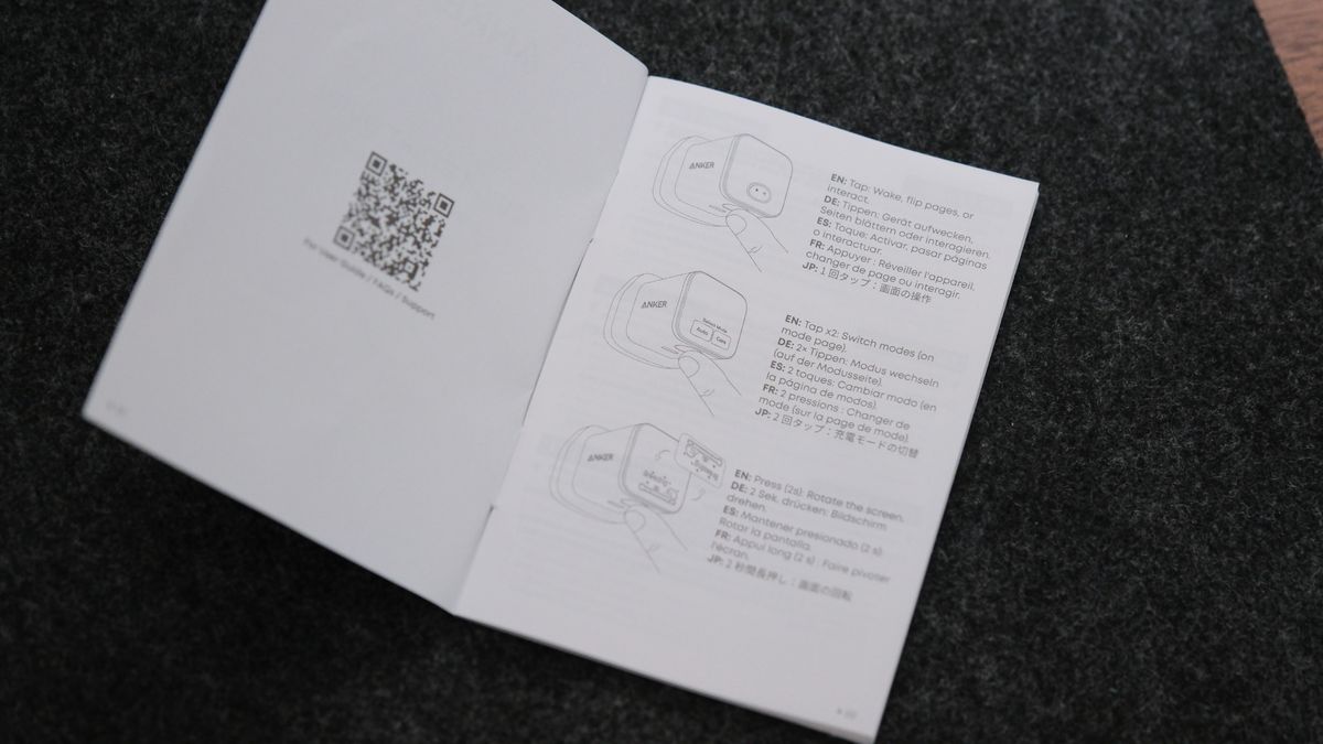 Open Anker Nano Charger instruction booklet showing diagrams and controls for the charger’s smart display.