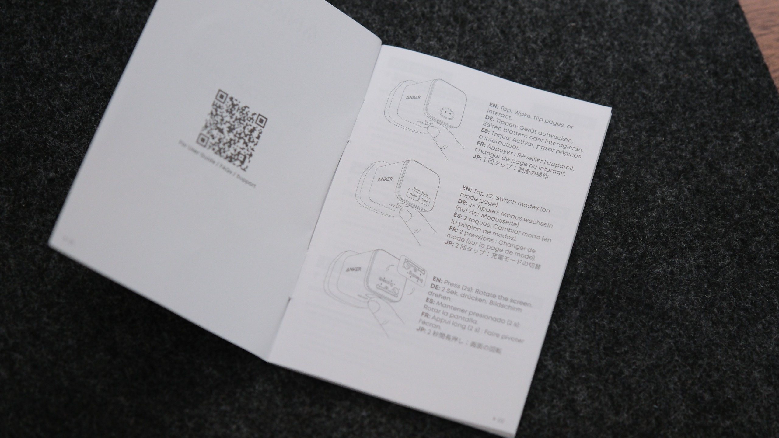Open Anker Nano Charger instruction booklet showing diagrams and controls for the charger&amp;rsquo;s smart display.