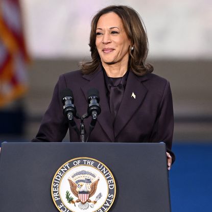 Kamala Harris speaking at Howard University wearing a purple suit