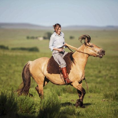 Gabriela Hearst on a brown horse
