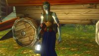 A screenshot of the World of Warcraft: Forever beta. An undead lady holds a glowing lantern while standing next to a wooden cart.