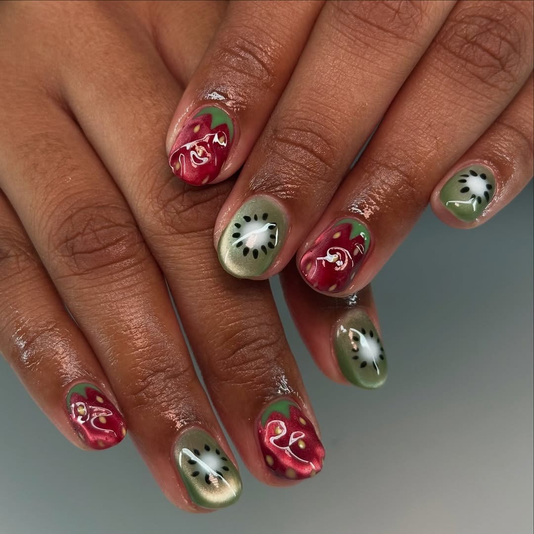 red and green nails with strawberry and kiwi designs
