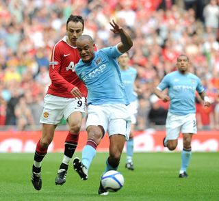 Manchester City’s Vincent Kompany (right) in action at Wembley (PA)