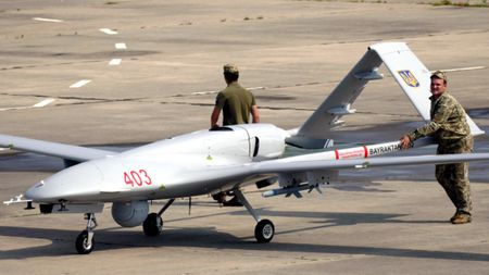 Ukrainian personnel push a TB2 drone during exercises in 2021