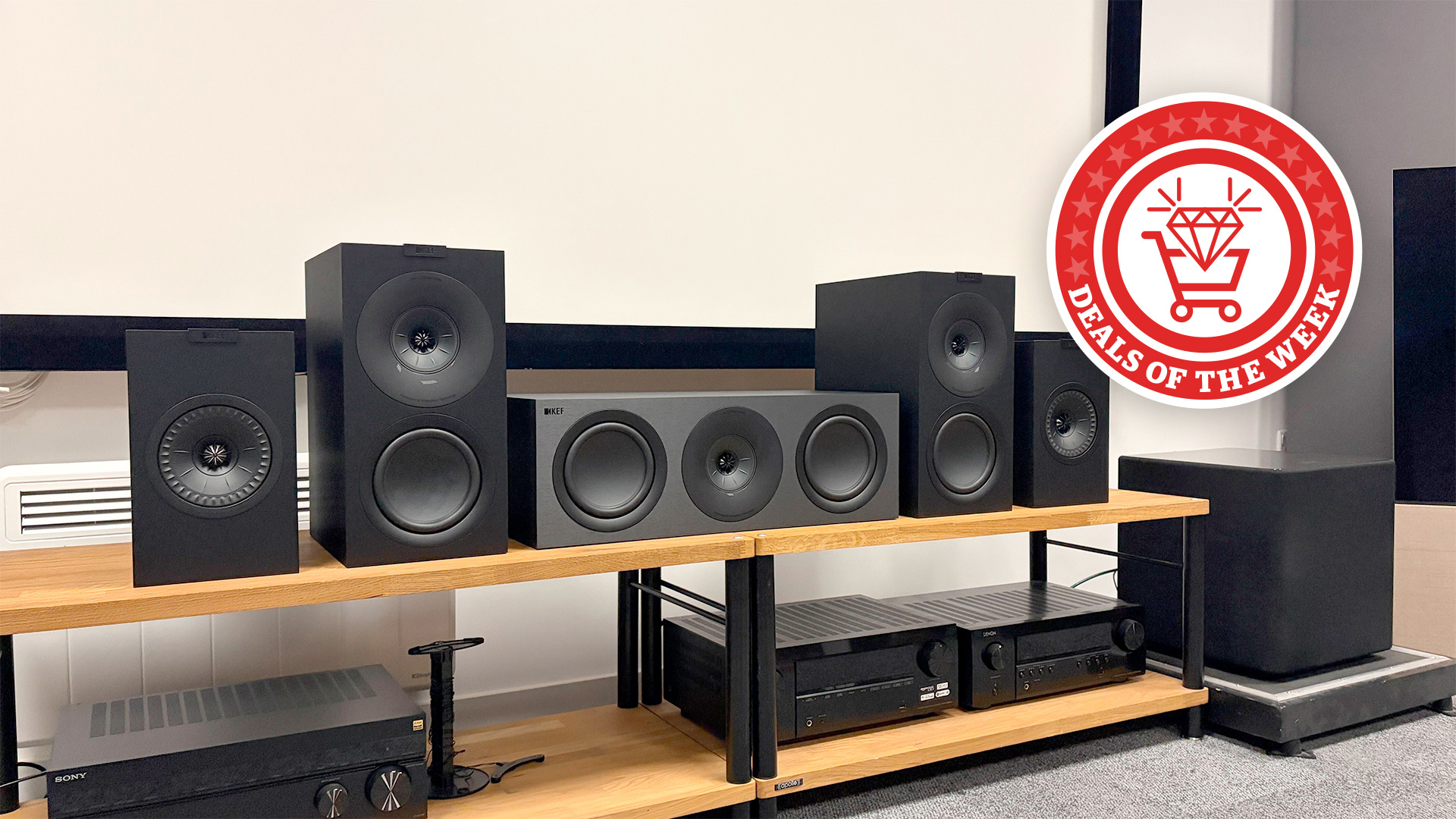 An image of the KEF Q Concerto Meta 5.1 in our test room, with the deals of the week logo overlaid