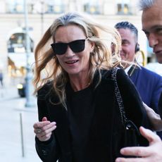 Kate Moss wearing a black and white outfit in Paris