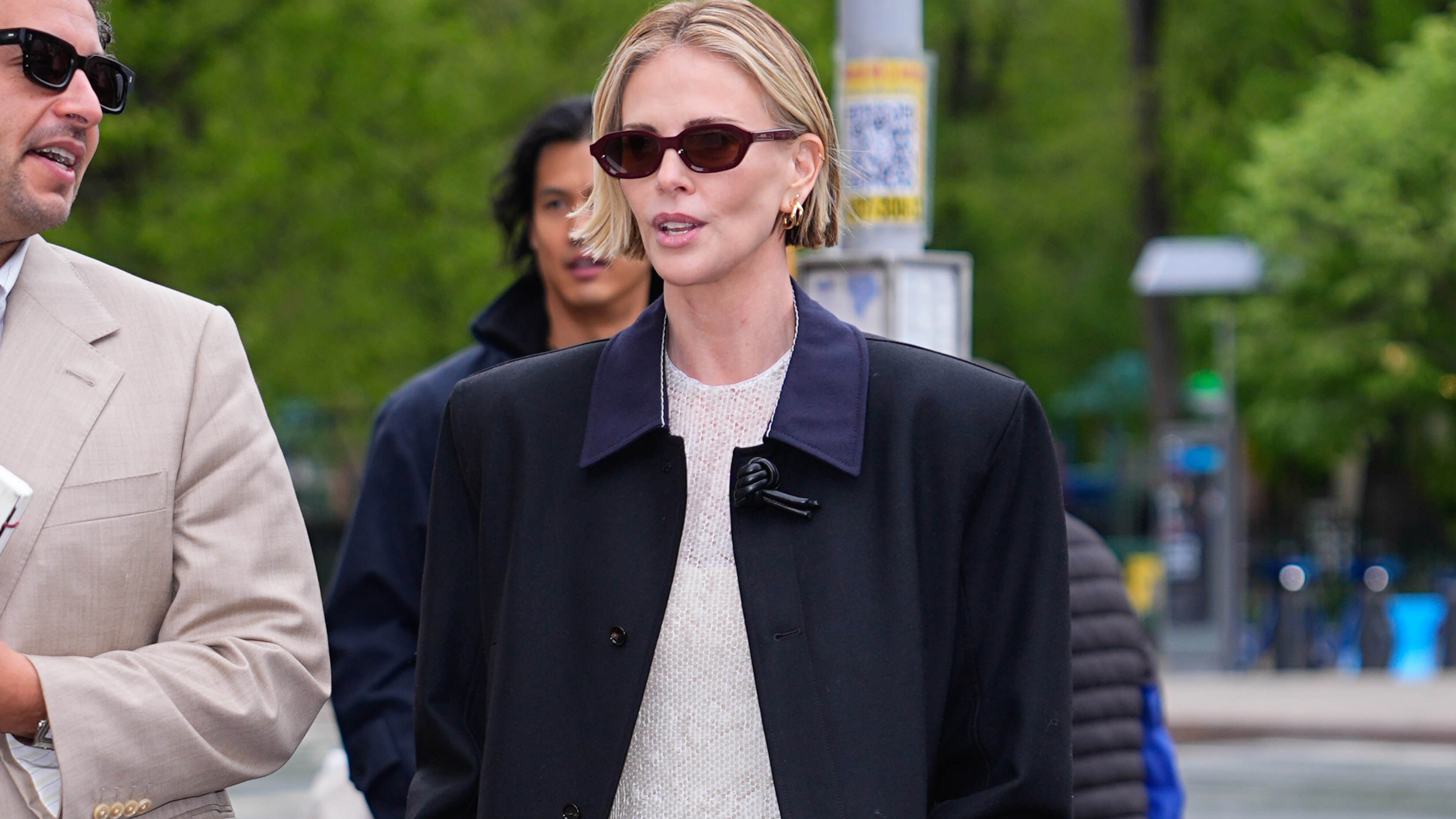 NEW YORK, NY - APRIL 22: Kareem Rahma and Charlize Theron are seen on April 22, 2026 in New York City. 