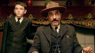 Dillon Freasier as H. W. Plainview Daniel Day-Lewis as Daniel Plainview in a conversation with someone else in There Will Be Blood