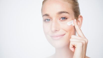 woman applying skincare cream - retinol alternatives