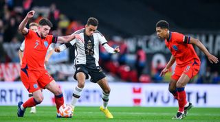 Germany's Jamal Musiala takes on England's Declan Rice and Jude Bellingham during England 3-3 Germany in the UEFA Nations League on 26 September, 2022 at Wembley Stadium, London, United Kingdom