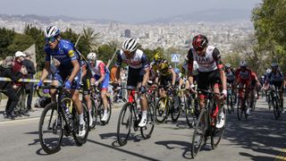 The peleton climbs with the city of Barcelona behind them at the Volta a Catalunya