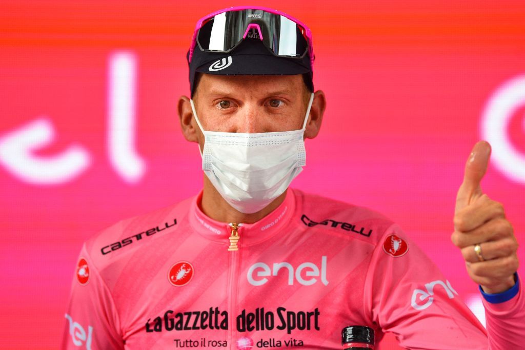 New overall leader Team Israel StartUp Nation rider Italys Alessandro De Marchi celebrates on the podium after the fourth stage of the Giro dItalia 2021 cycling race 187 km between Piacenza and Sestola EmiliaRomagna on May 11 2021 Photo by Dario BELINGHERI AFP Photo by DARIO BELINGHERIAFP via Getty Images