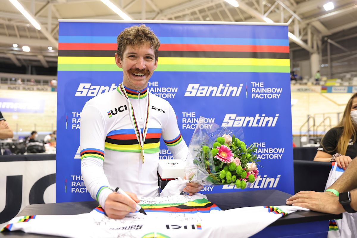 Picture by Simon Wilkinson/SWpix.com - 22/10/2021 - Cycling - Tissot 2021 UCI Track Cycling World Championships - Men's Individual Pursuit Finals - Stab Velodrome, Roubaix, France - The USA's Ashton Lambie signs Santini rainbow jerseys after taking gold in the men's individual pursuit.