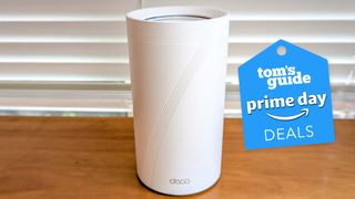 A TP-Link mesh router with a Tom's Guide Prime Day deals badge