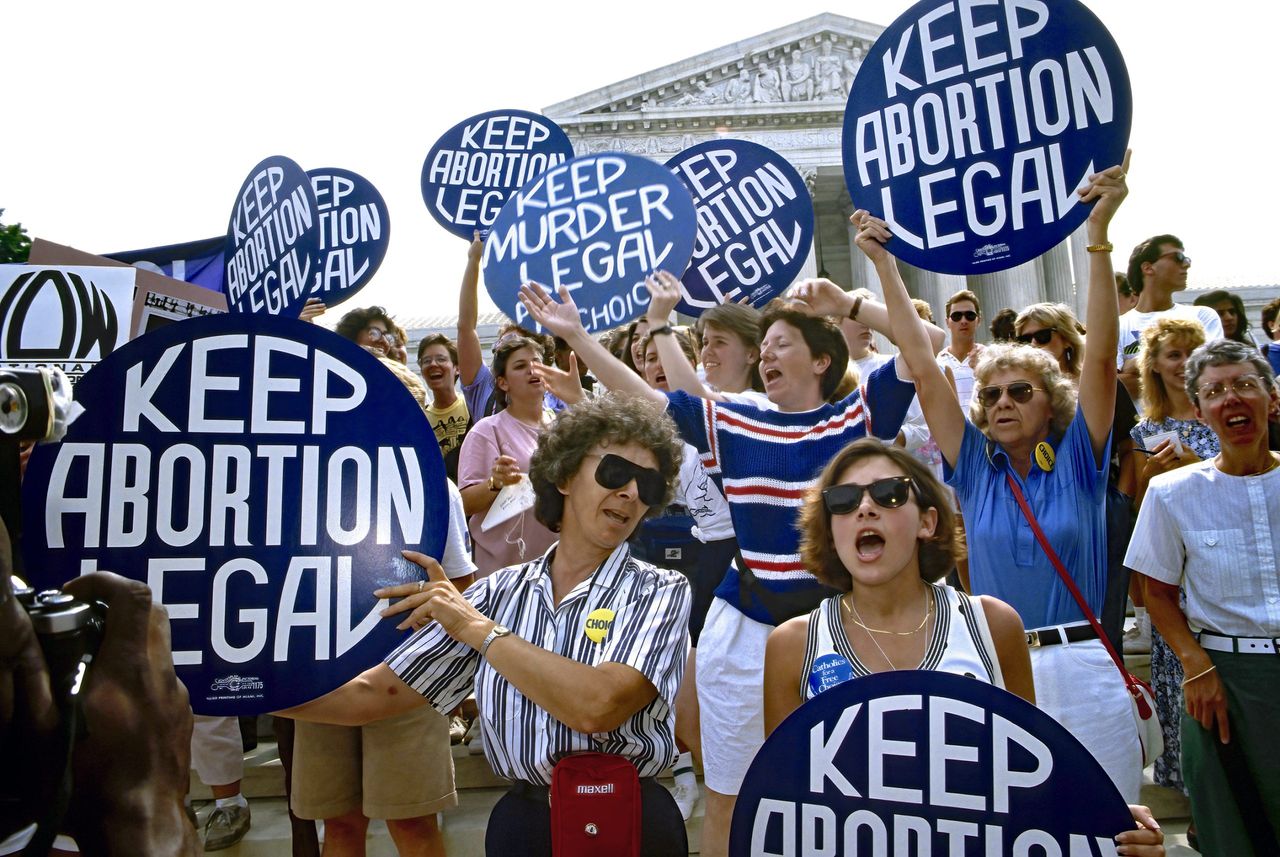 Women celebrate the US Supreme Court ruling on webster v. reproduction health services