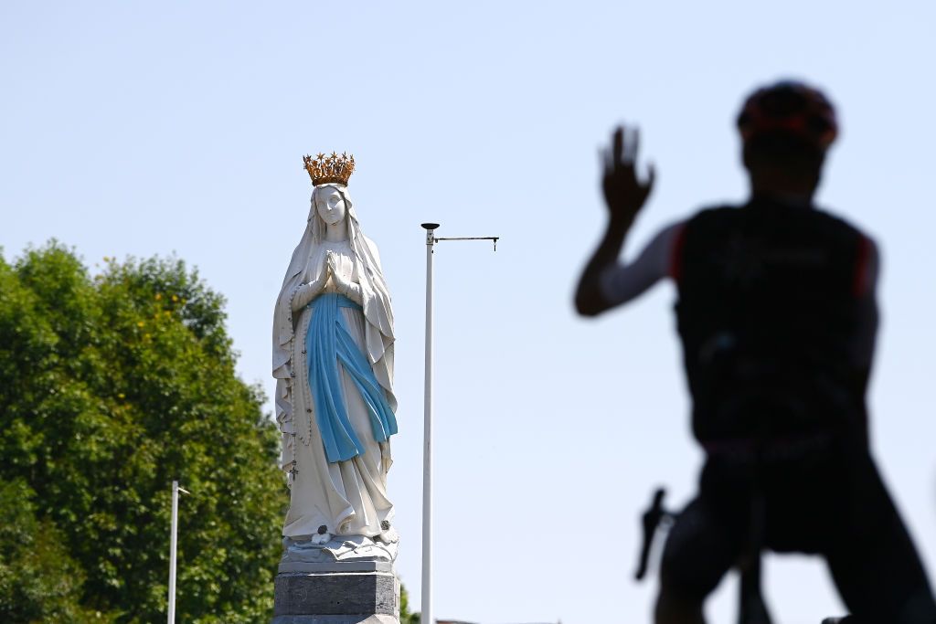 HAUTACAM FRANCE JULY 21 Silhouette of Team Cofidis and statue of our Lady of Lourdes during the team presentation prior to the 109th Tour de France 2022 Stage 18 a 1432km stage from Lourdes to Hautacam 1520m TDF2022 WorldTour on July 21 2022 in Hautacam France Photo by Tim de WaeleGetty Images
